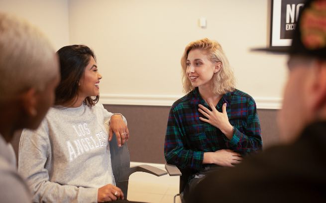 Group of people in Evolve's living room